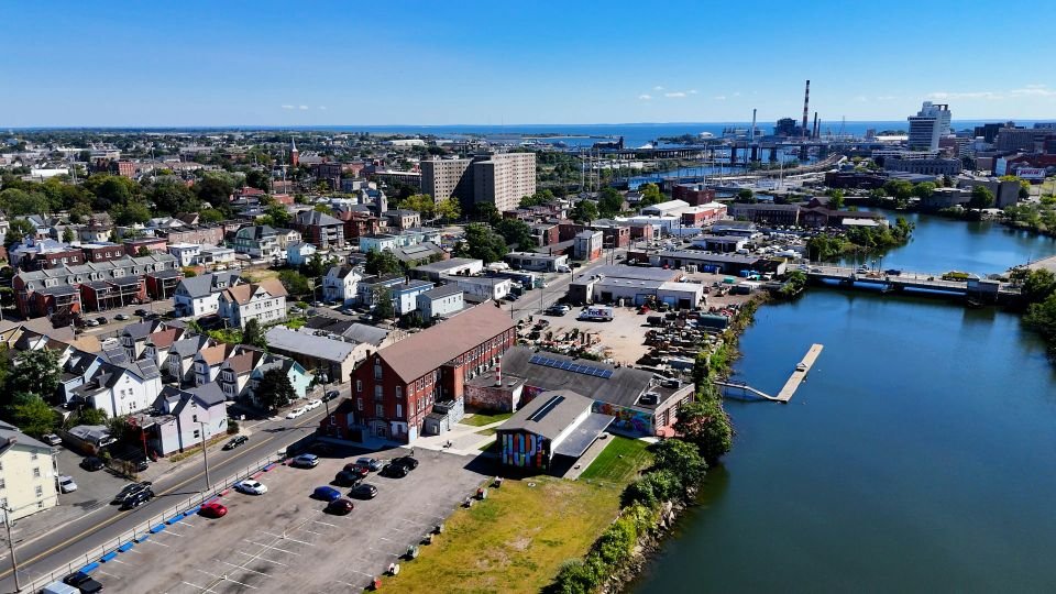 A riverside town seen from the air, the kind of community our collectors drive out to each week