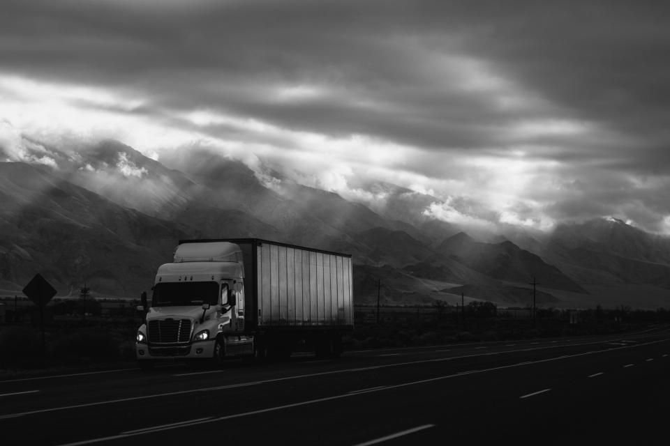 A commercial truck on the highway, the FMCSA regulated work that makes up most DOT testing in North Carolina